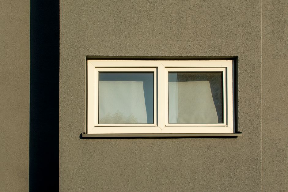 Close up of a clean white vinyl window frame